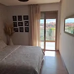 Bel Appartement A Marrakech Dans La Residence Pearl Garden Avec Piscine Situee Sur La Route De Casablanca Sa Grande Terrasse A Une Splendide Vue Sur La Ville Et Les Montagnes De L\'Atlas A Quelques Minutes Du Centre Ville Et Du Grand Stade De Marrakec